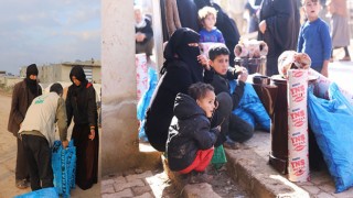Suriyeliler yardımlarla ısınıyor